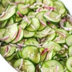 cucumber salad in white dish - angled shot