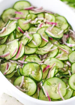 cucumber salad in white dish - angled shot