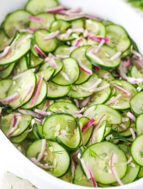 cucumber salad in white dish - angled shot