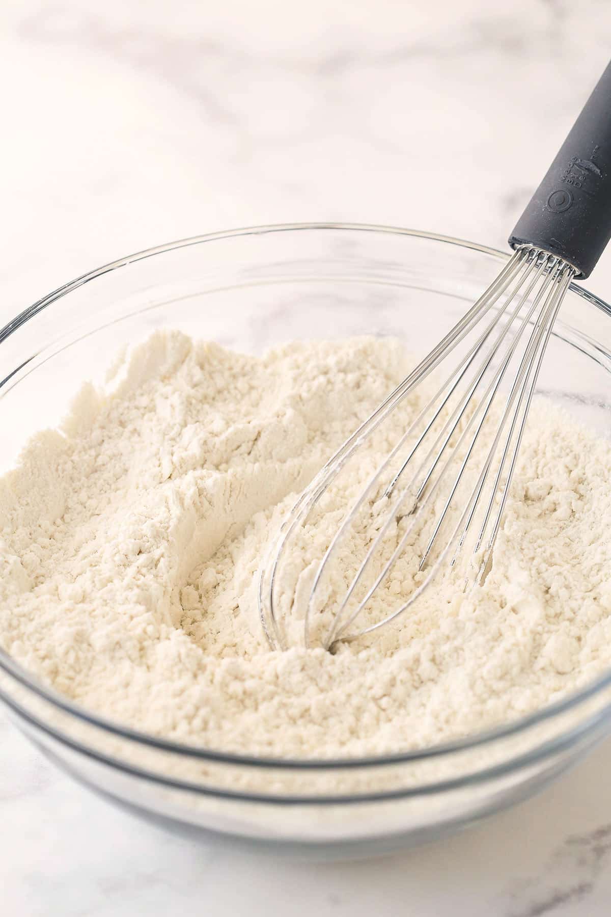 Mixing dry ingredients for sugar cookies.