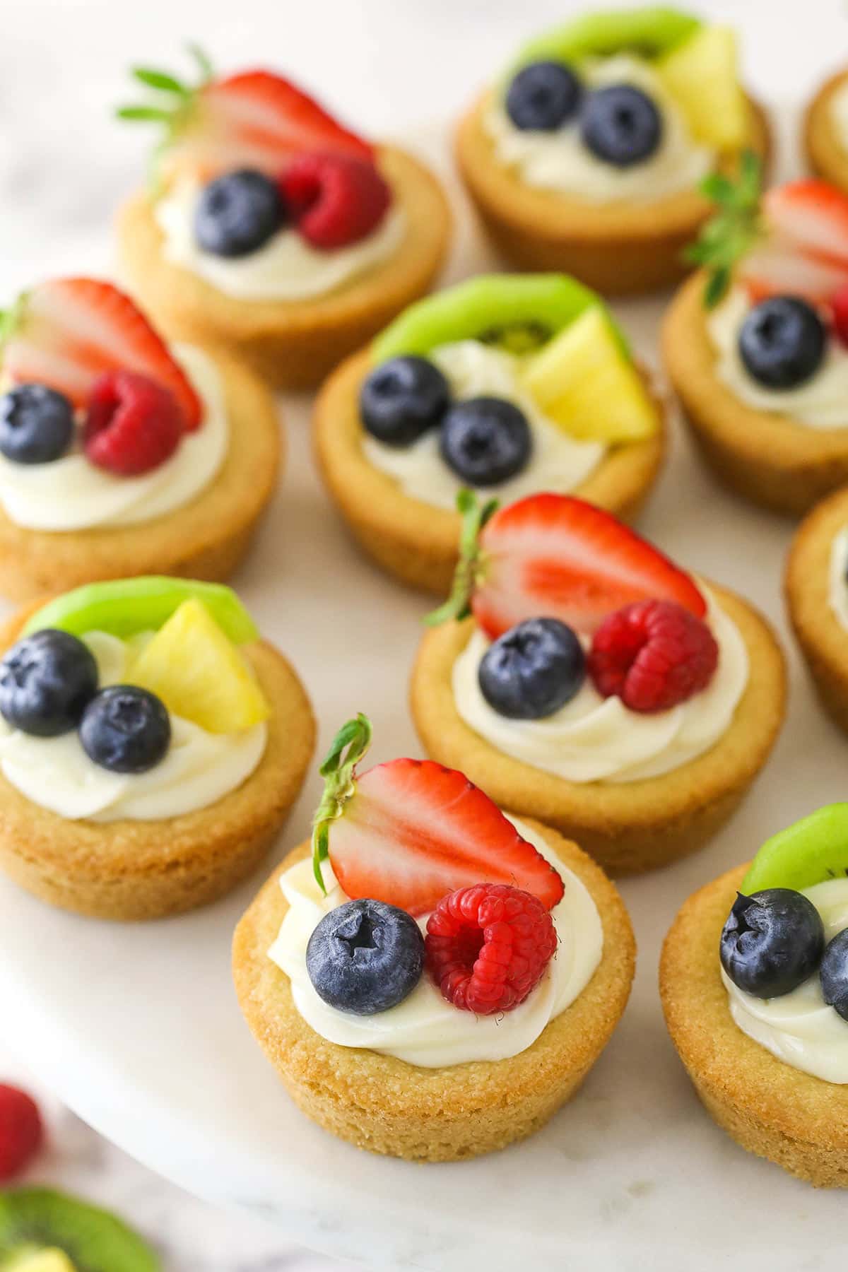 Overhead of easy fruit cheesecake cookie cups.