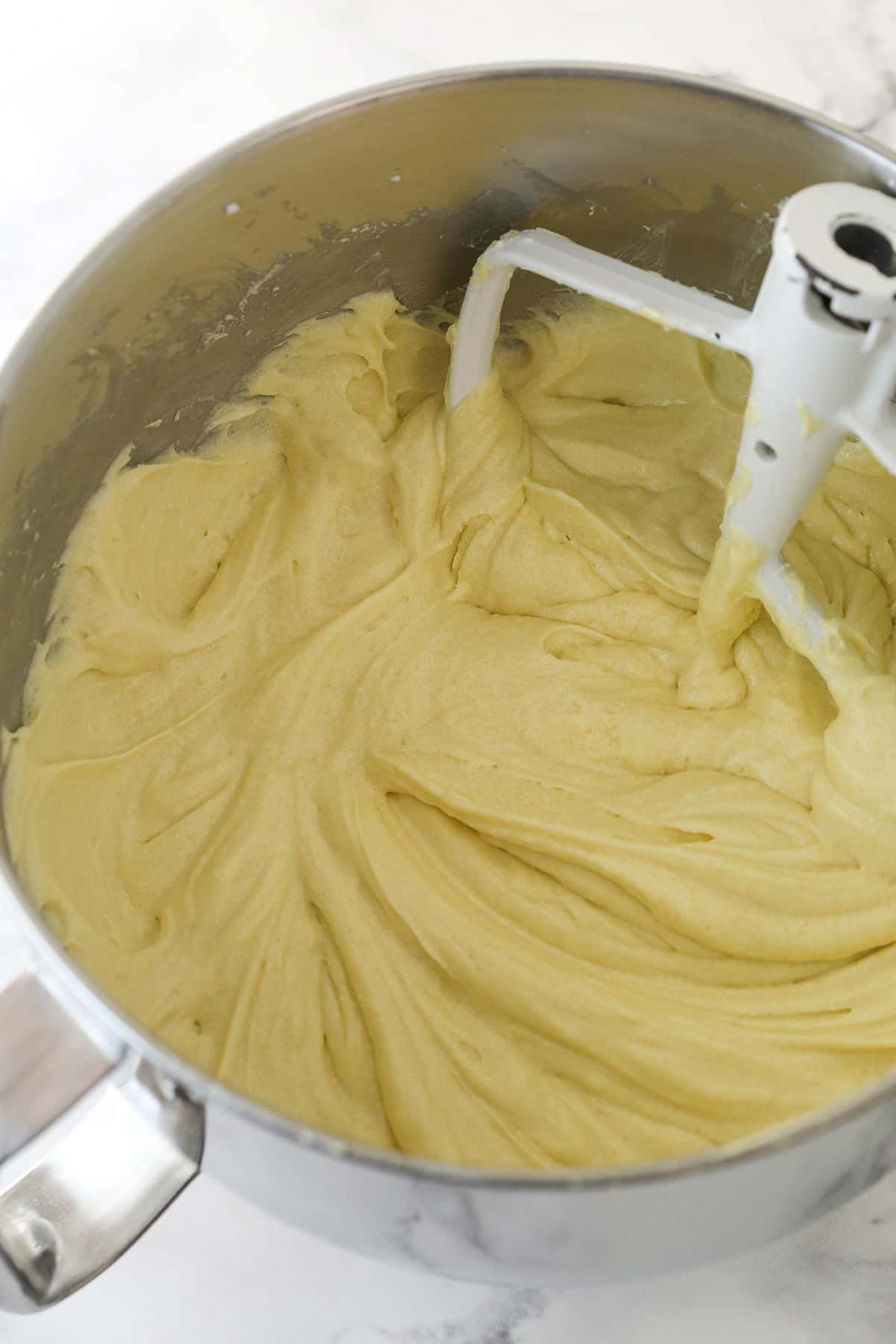 Combining dry and wet ingredients for cake batter.