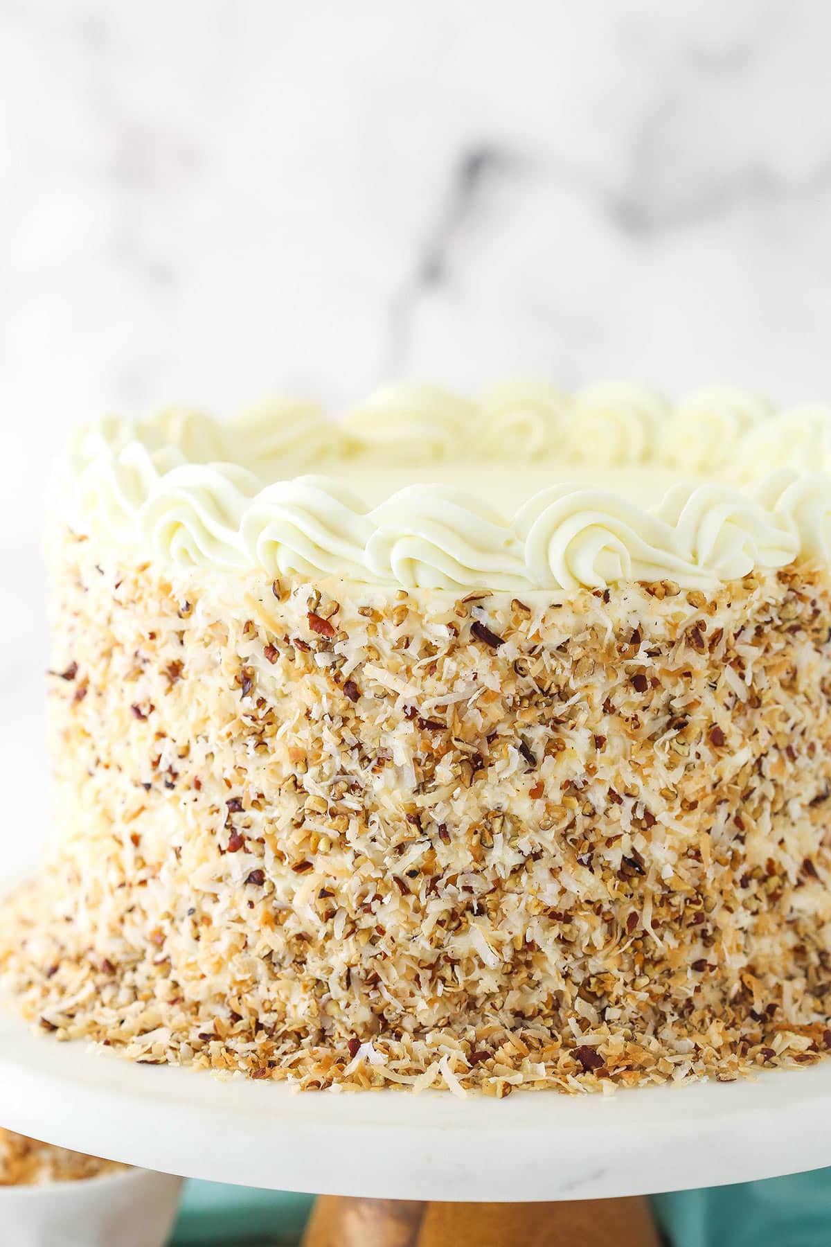 Italian cream cake on a cake stand.