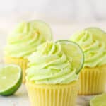 Side view of three Key Lime Coconut Cupcakes