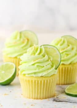 Side view of three Key Lime Coconut Cupcakes