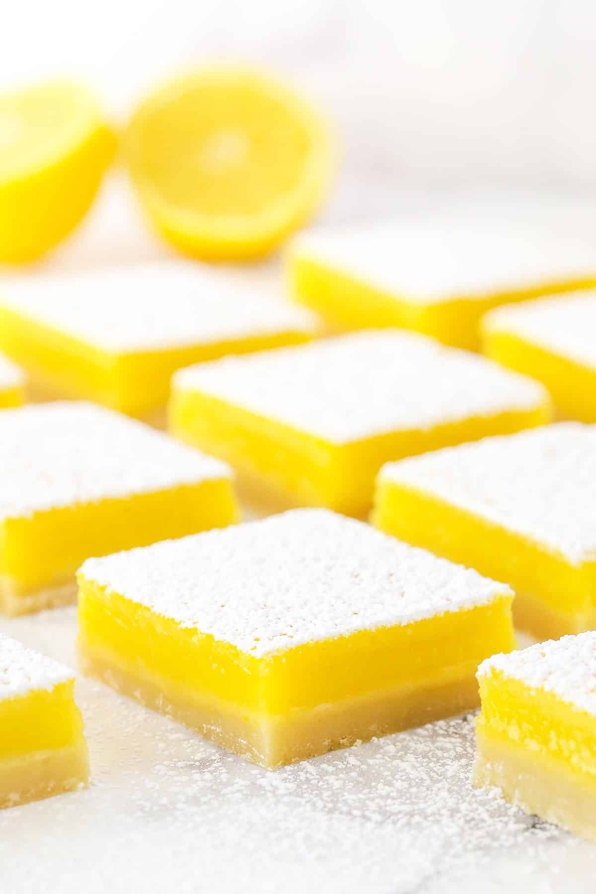 Side view of lemon bars dusted with powdered sugar