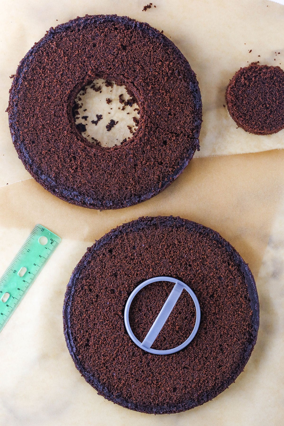 A step in making a Resurrection Cake showing removing the center of the chocolate cake using a biscuit cutter