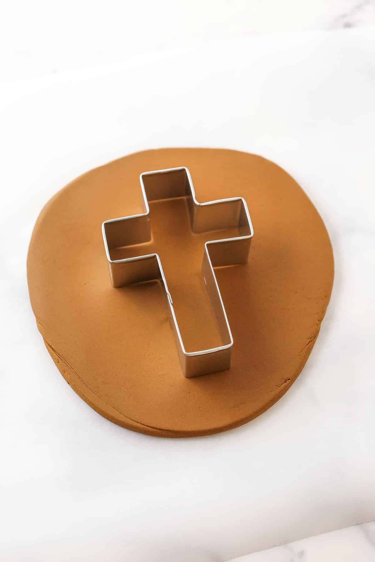 A step in making a Resurrection Cake showing how to make the cross using a cookie cutter