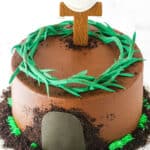 Side view of a Resurrection Cake decorated with a fondant cross and crown of thorns