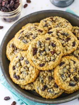 Overhead view of a grey plate stacked with homemade Oatmeal Raisin Cookies