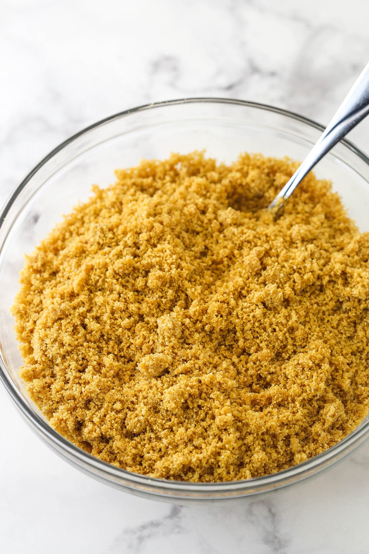 Mixing together ingredients for Graham Cracker crust.