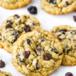 Overhead view of Cherry Chocolate Chip Oatmeal Cookies spread out on a white marble table top.