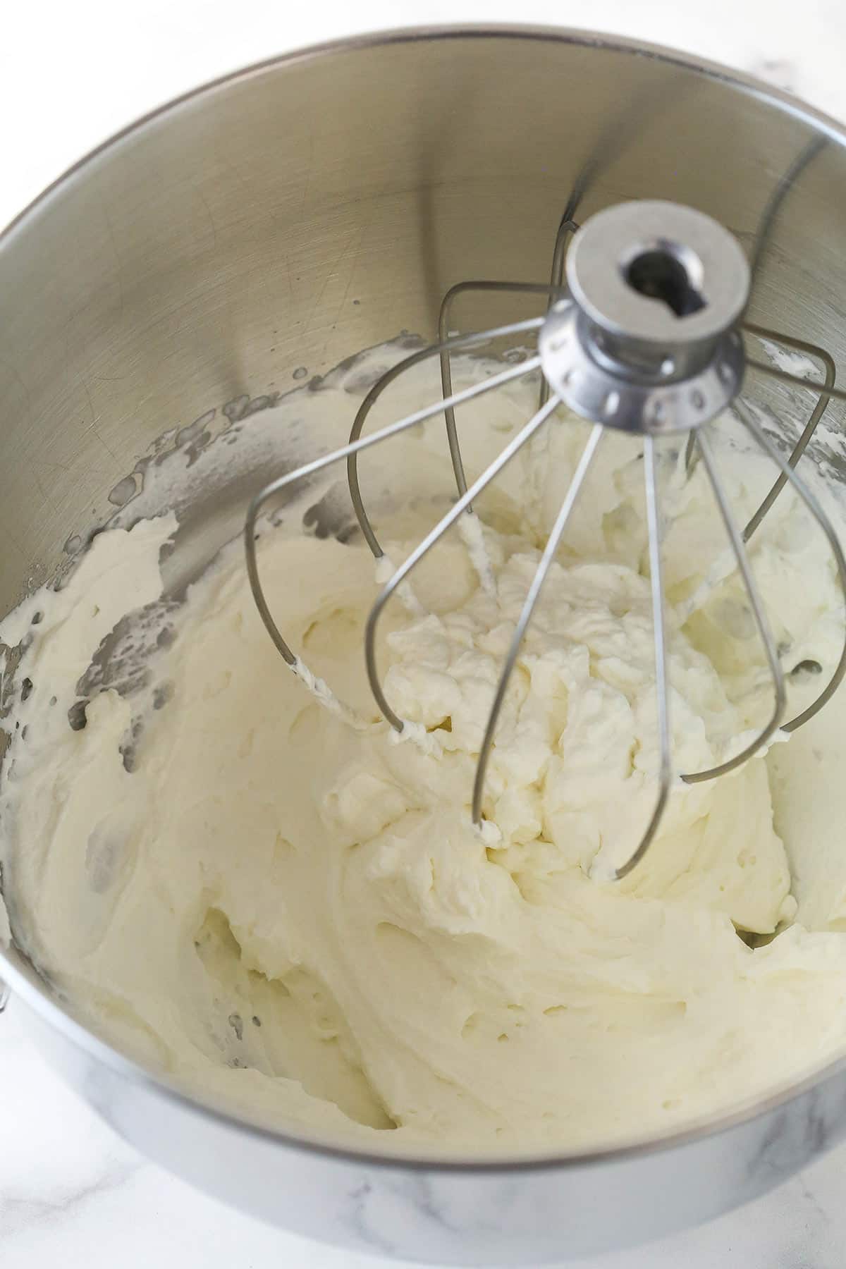 Whipping up whipped cream in a mixing bowl.