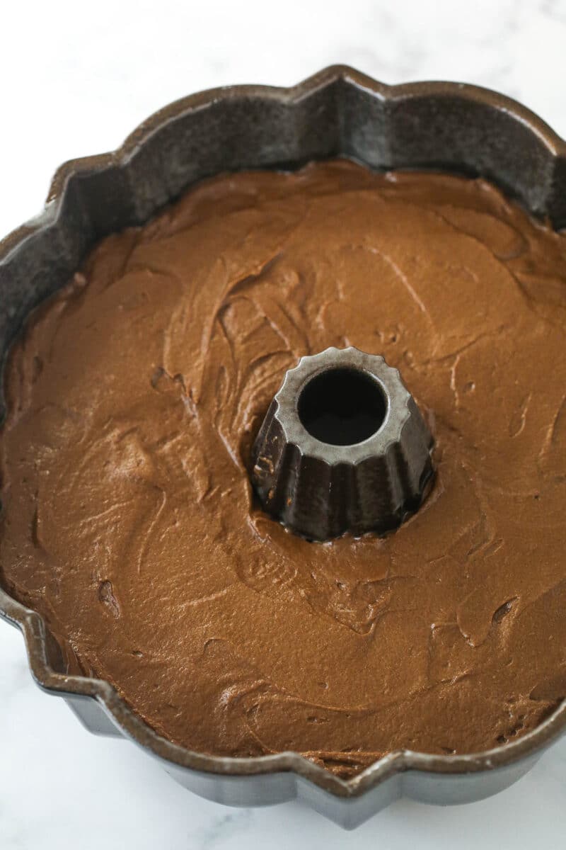 Chocolate batter in a bundt pan.