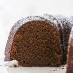 Closeup of chocolate pound cake with a bite taken out of it.