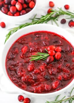 Overhead view of easy homemade Cranberry Sauce in a white bowl on a white table