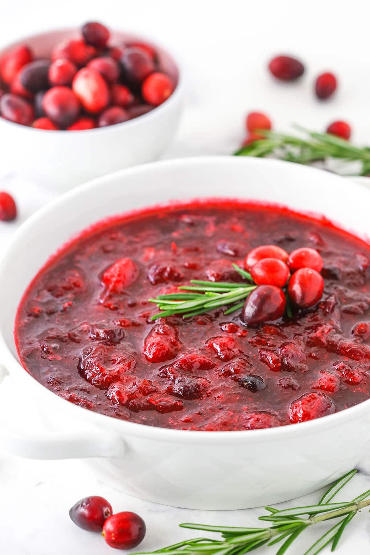 Easy homemade Cranberry Sauce in a white bowl on a white table