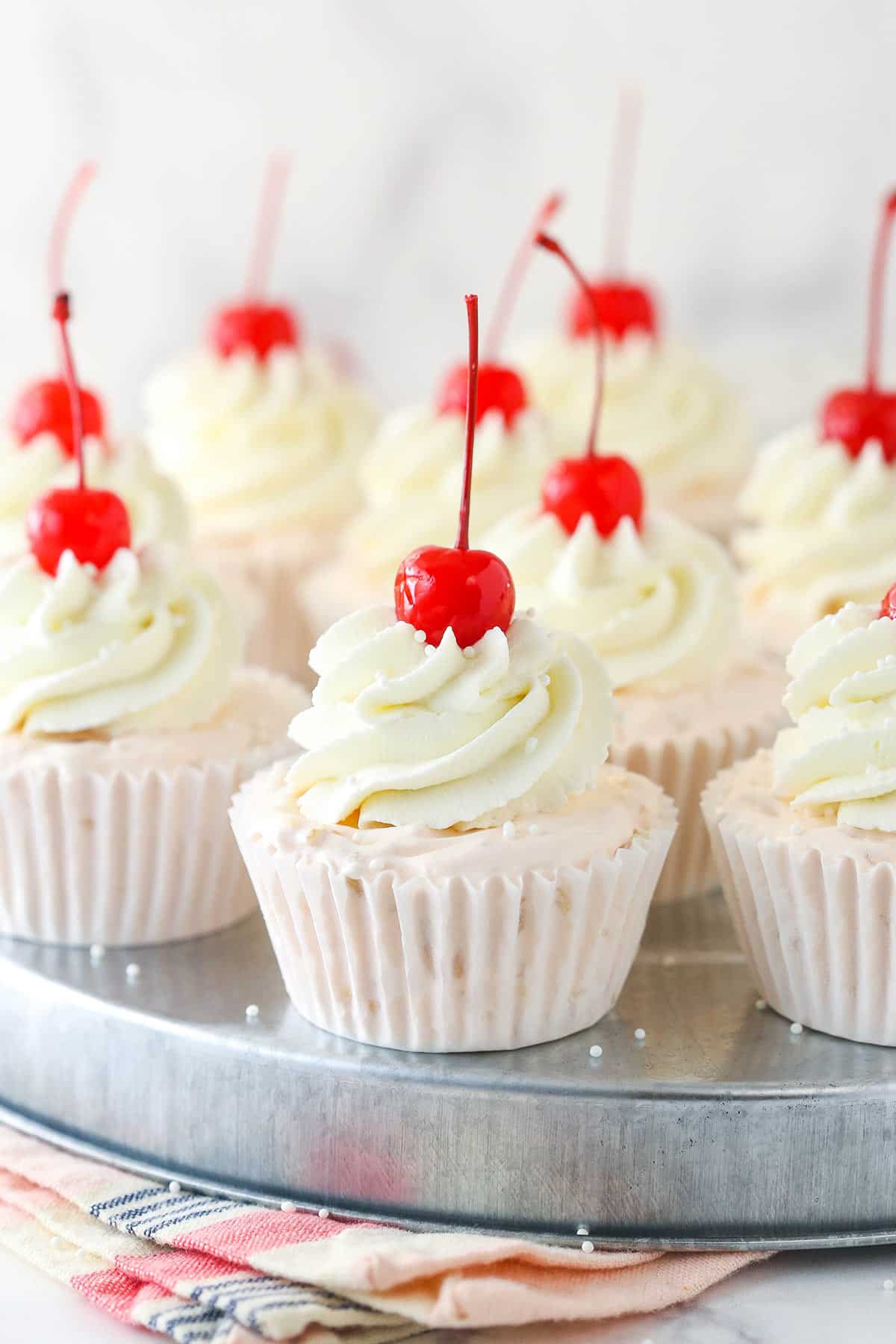 Frozen fruit salad cupcakes on a serving platter.