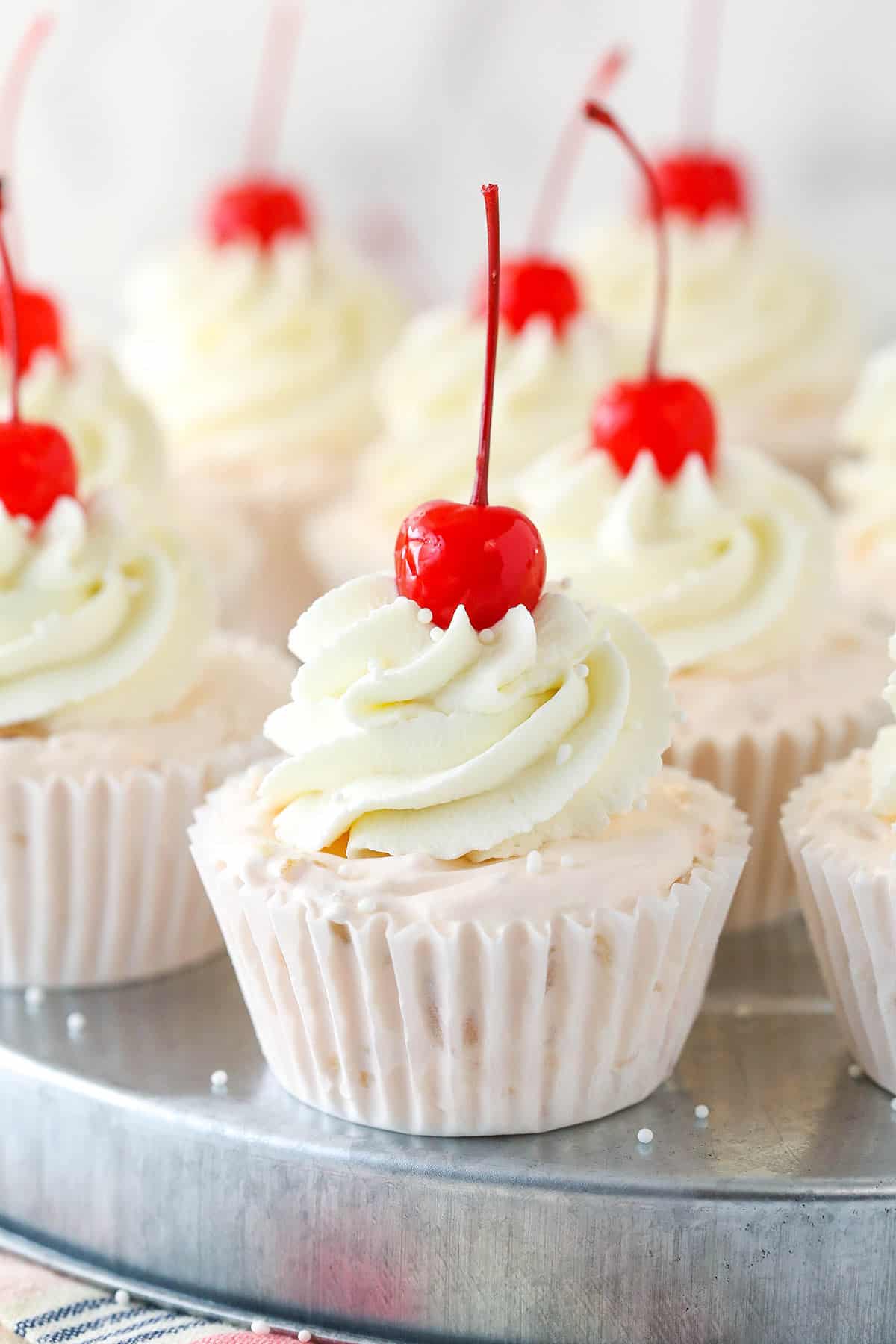 Frozen fruit salad cupcakes on a serving platter.