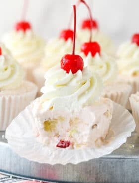 Closeup of a frozen fruit salad cupcake with a bite taken out of it.