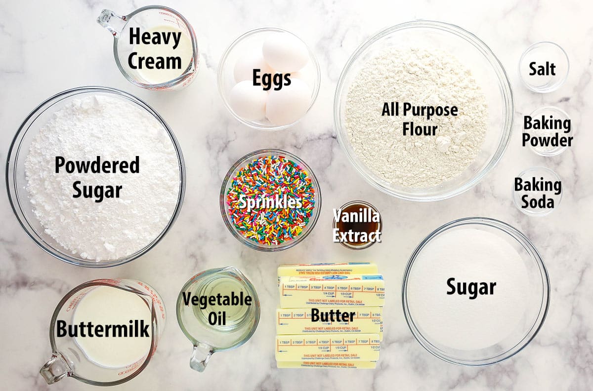 Ingredients for Funfetti cake separated into bowls.