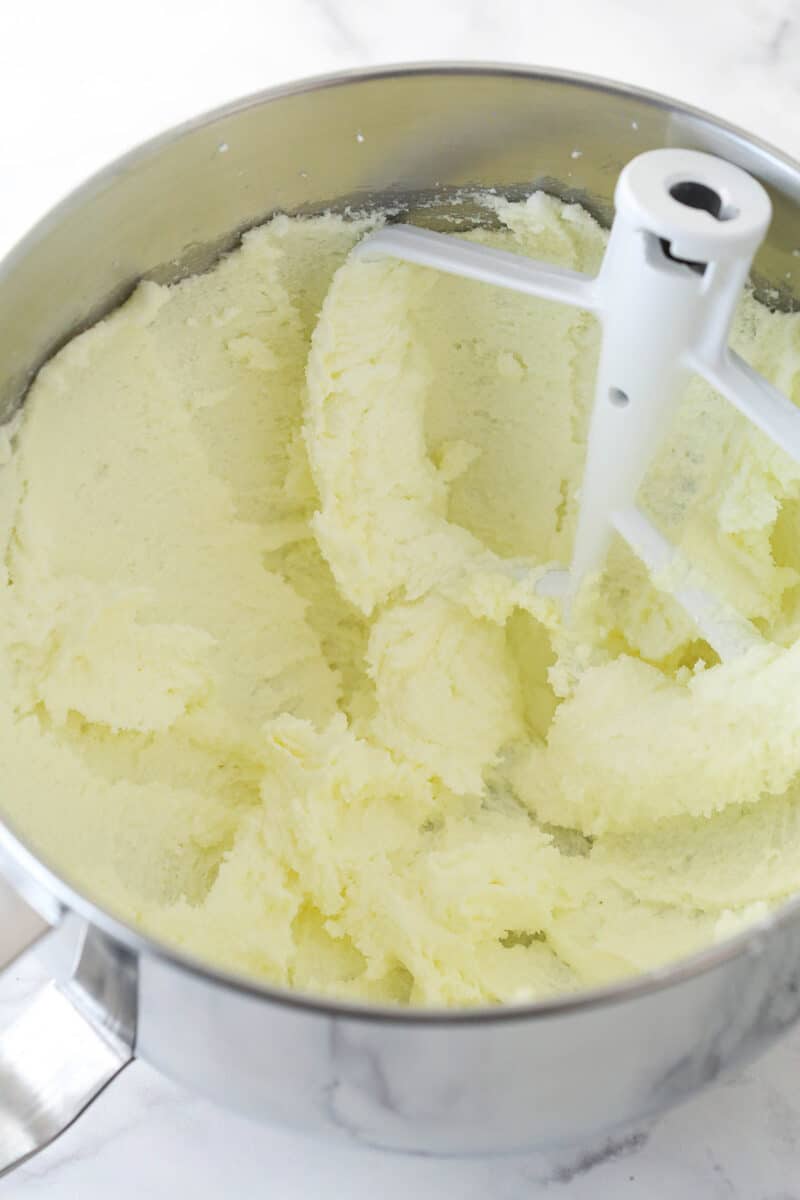 Creaming together butter and sugar for cake batter.