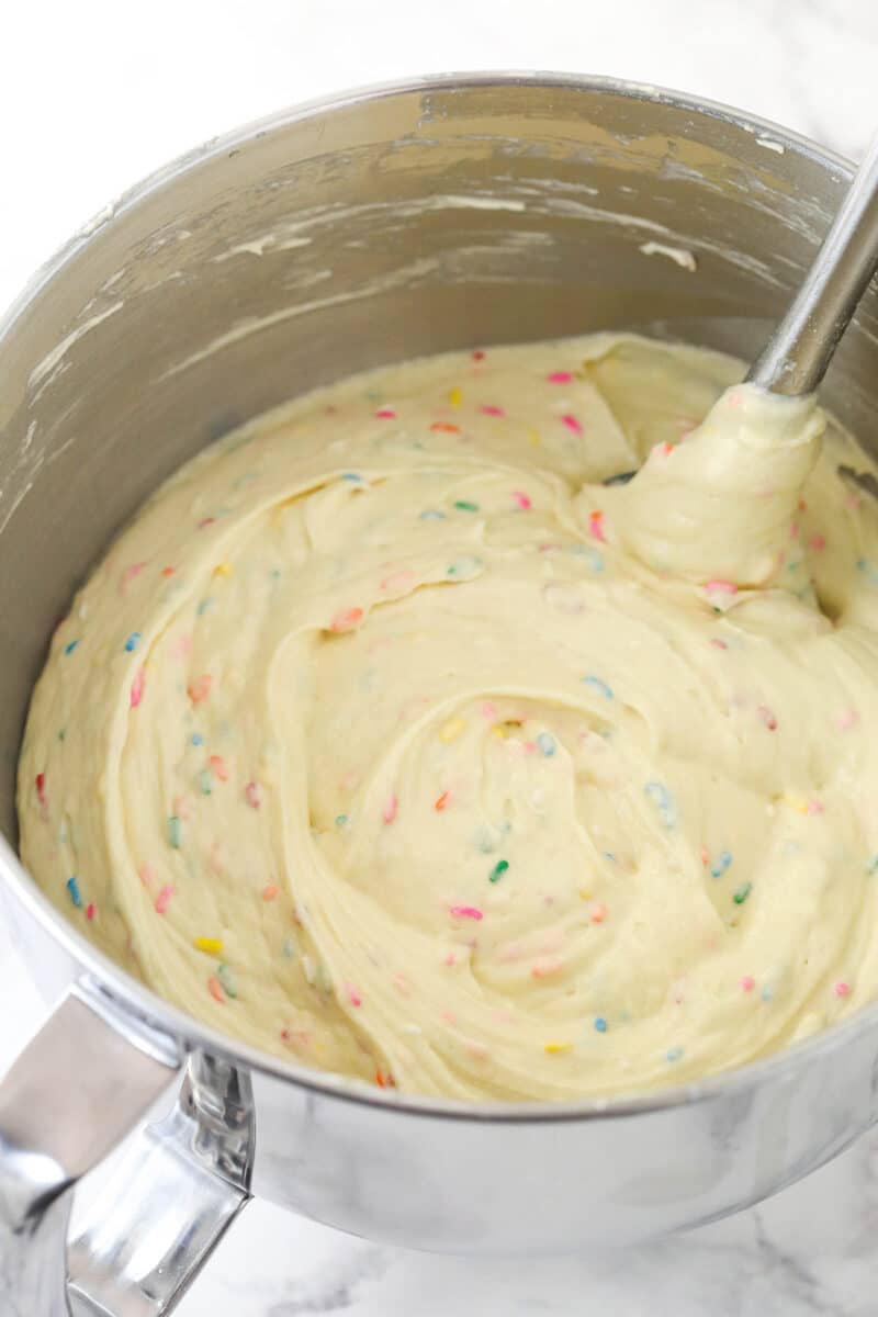 Mixing Funfetti cake batter in a mixing bowl.