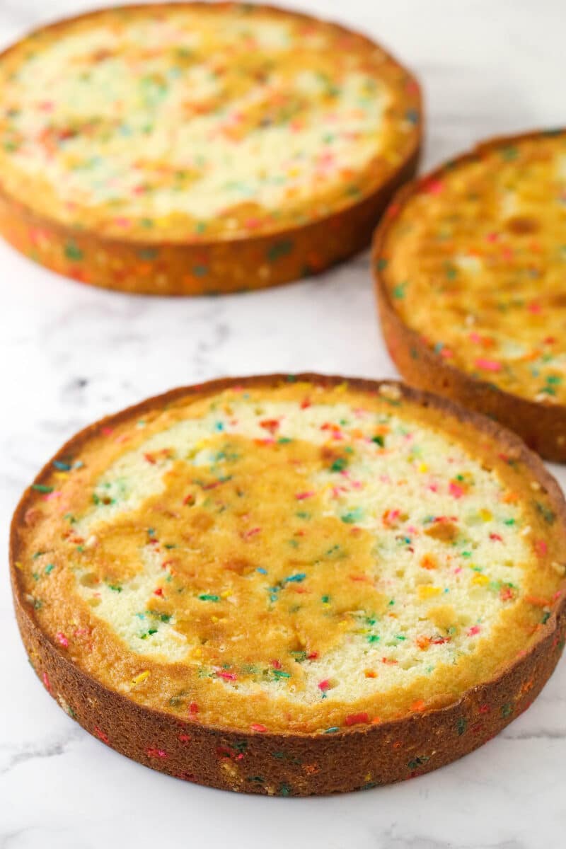 Baked layers of Funfetti layer cake ready to stack.
