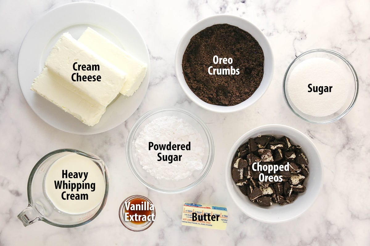 Ingredients for Oreo cheesecake on a marble counter