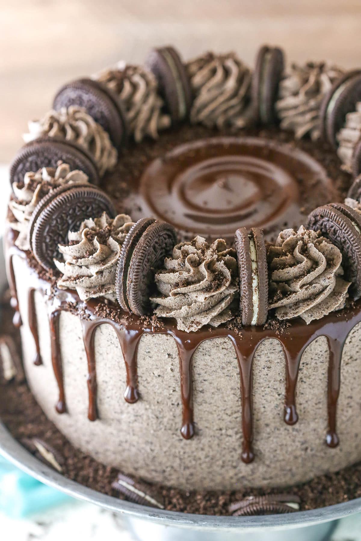 Overhead of chocolate Oreo cake on a cake stand.