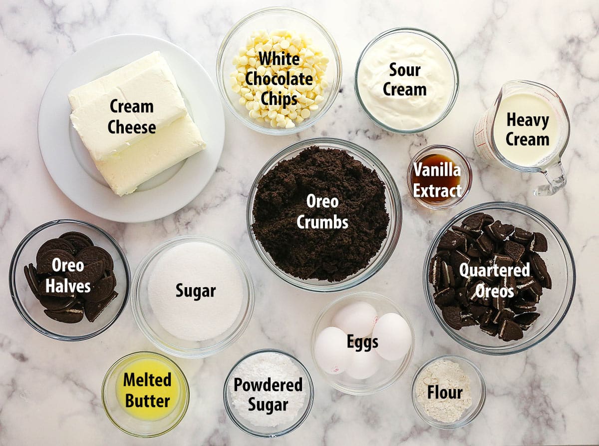 Ingredients for the BEST Oreo cheesecake separated into bowls.