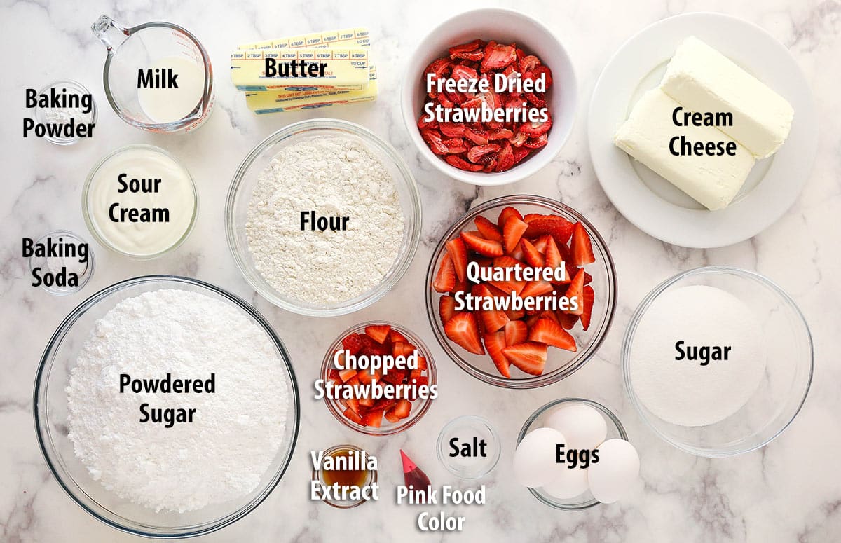 Ingredients for strawberry cake separated into bowls.