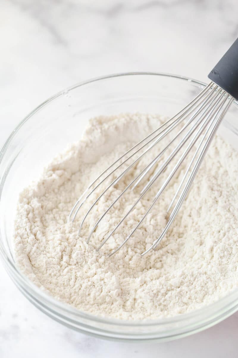 Whisking together dry ingredients for cupcake batter.