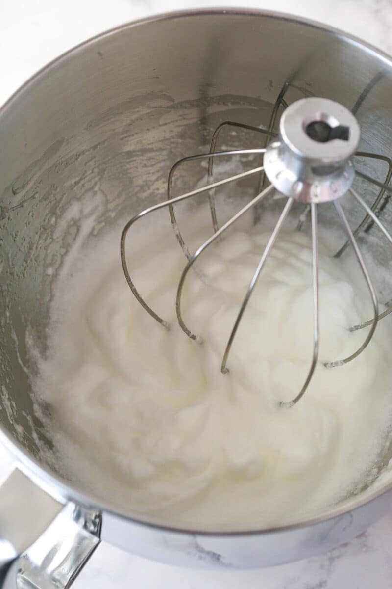 Whipping egg whites in a mixing bowl.