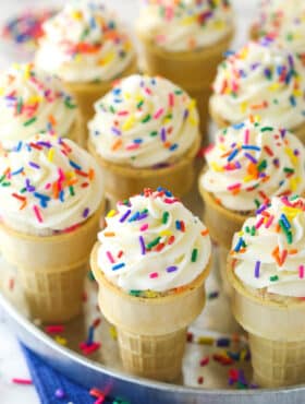 Overhead of ice cream cone cupcakes on a serving tray.