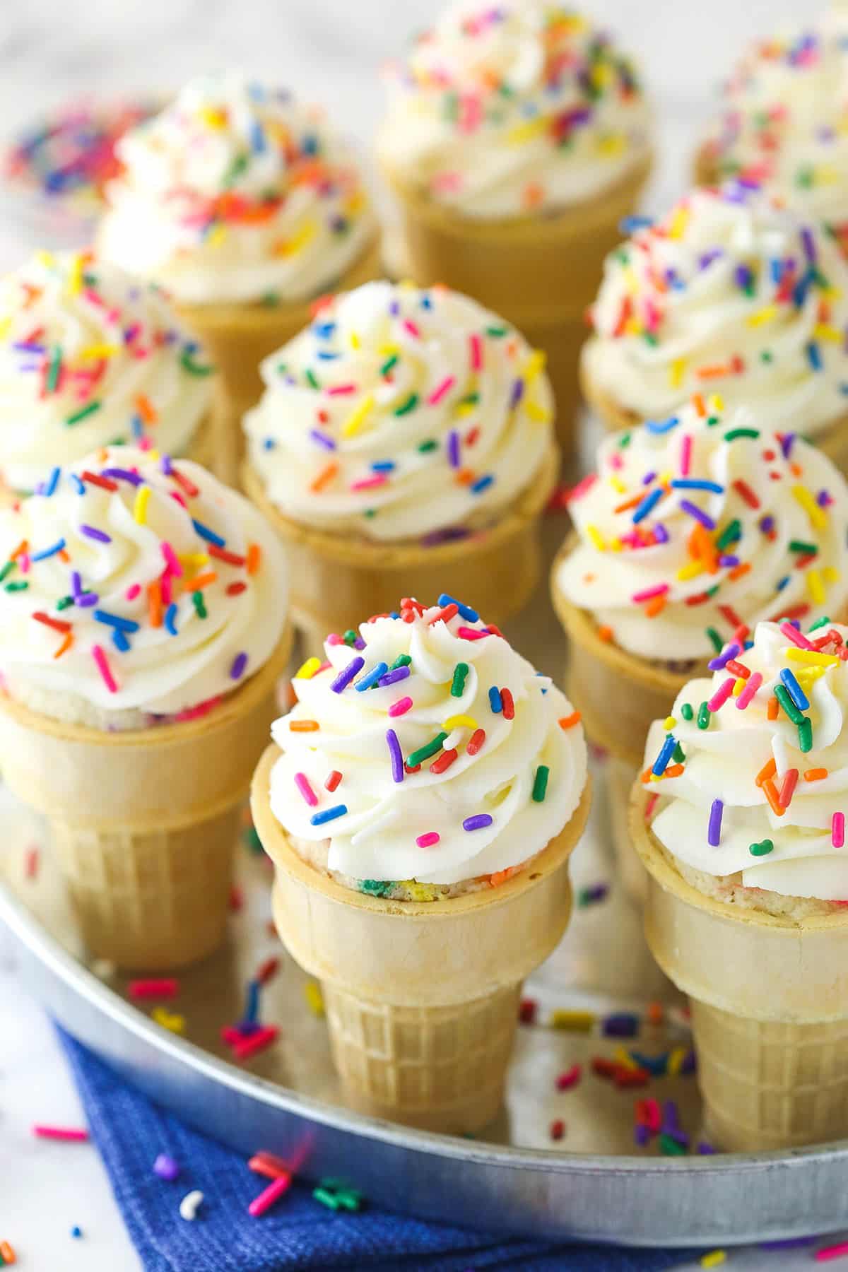 Overhead of ice cream cone cupcakes on a serving tray.