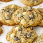 Closeup of kitchen sink cookies on a flat surface. One is stacked on top of the others.