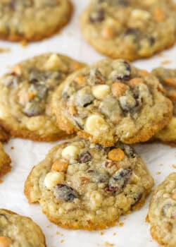 Closeup of kitchen sink cookies on a flat surface. One is stacked on top of the others.