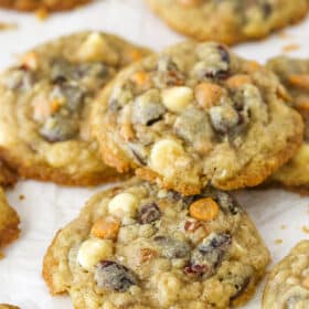 Closeup of kitchen sink cookies on a flat surface. One is stacked on top of the others.