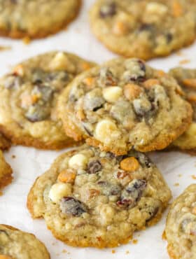 Closeup of kitchen sink cookies on a flat surface. One is stacked on top of the others.