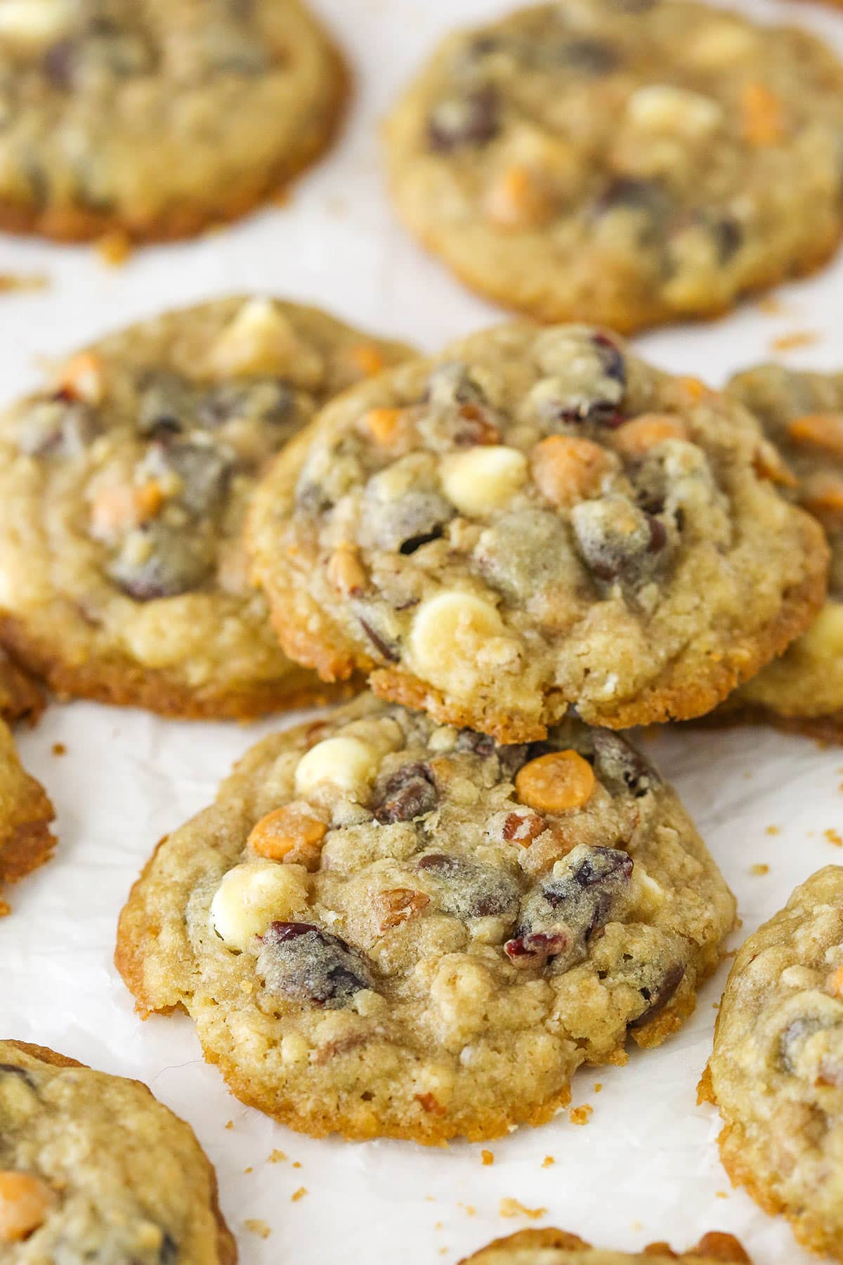 Closeup of kitchen sink cookies on a flat surface. One is stacked on top of the others.