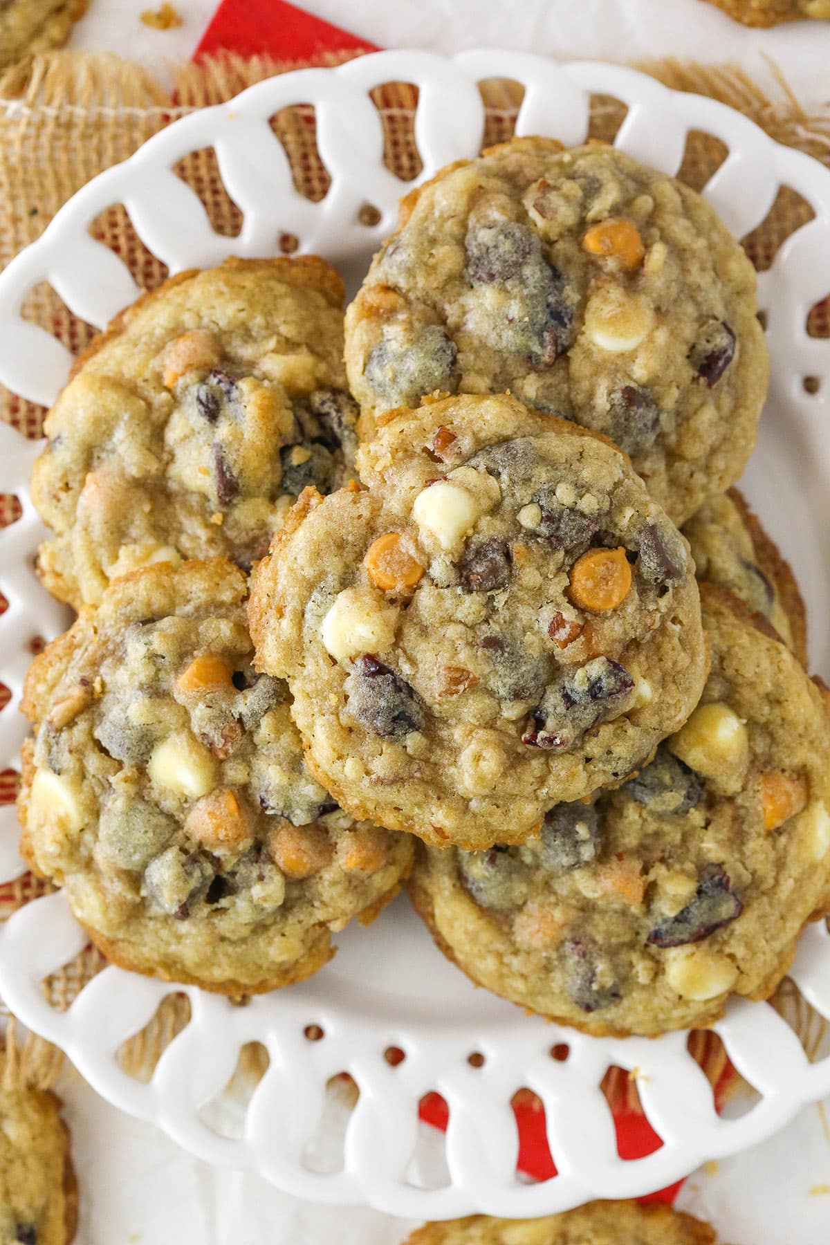 Overhead of kitchen sink cookies in a pile on a plate.