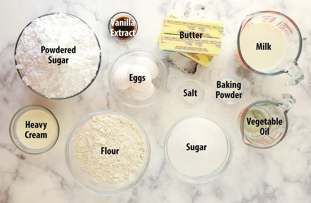 Ingredients for vanilla layer cake separated into bowls.