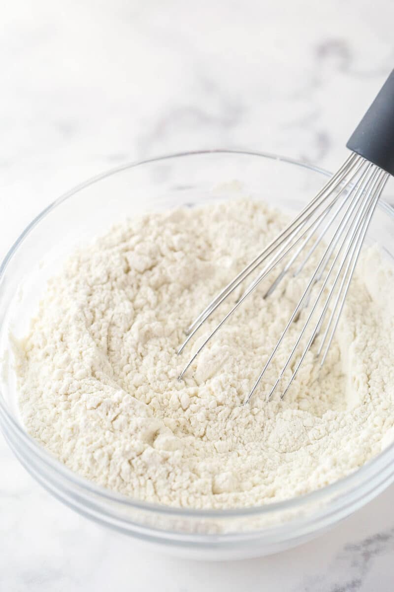 Whisking together dry ingredients for vanilla cake.