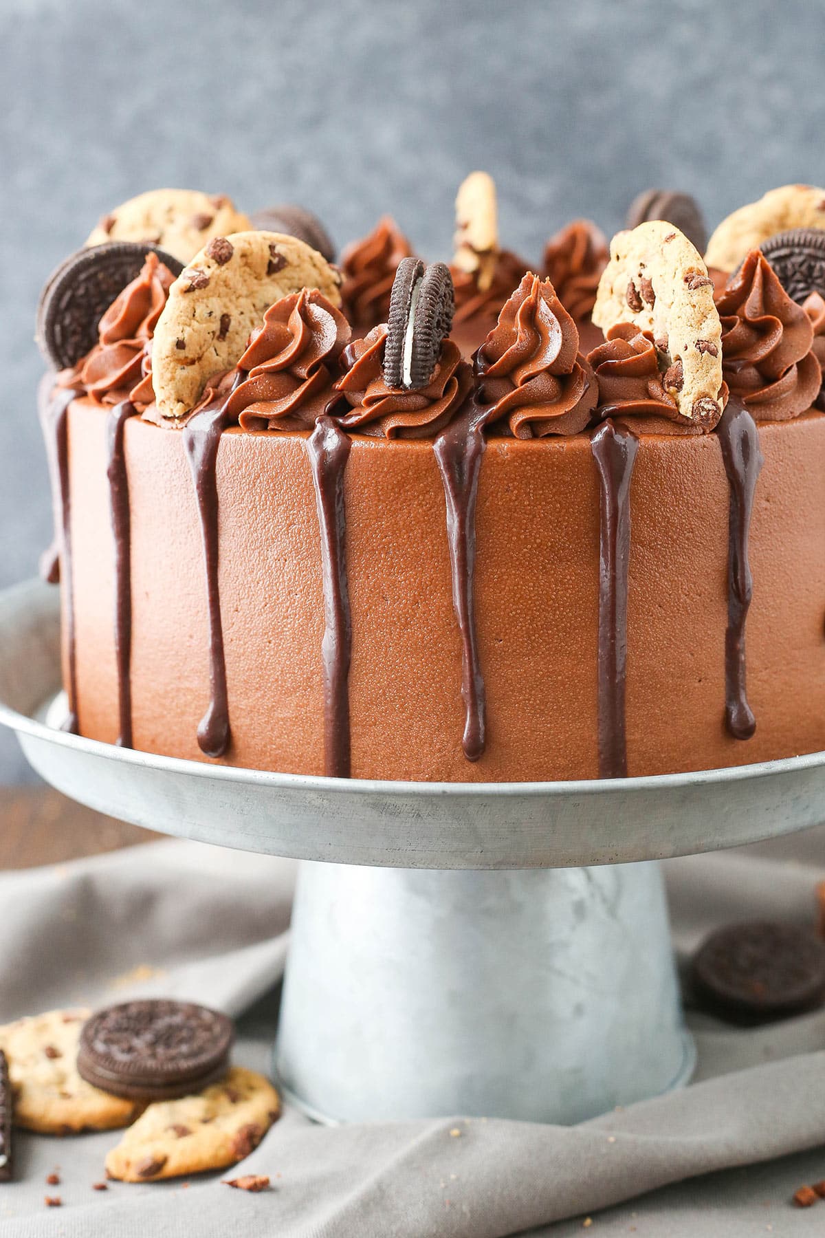 Oreo brookie layer cake on a cake stand.