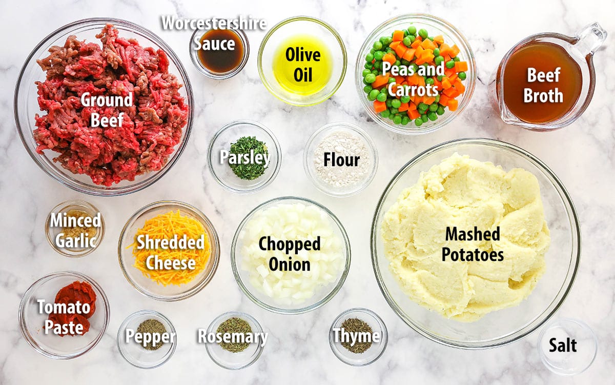 This easy Sheperd's Pie is made of perfectly seasoned ground beef and veggies topped with mashed potatoes and cheese and baked to bubbly. Ingredients for shepherd's pie separated into bowls and labeled.