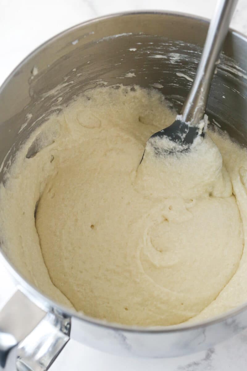 Folding egg whites into cupcake batter.
