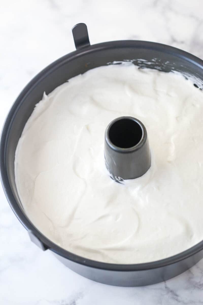 Angel food cake batter in an angel food cake pan ready to be baked.