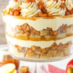 Side view of a full Caramel Apple Cheesecake Blondie Trifle in a glass trifle stand