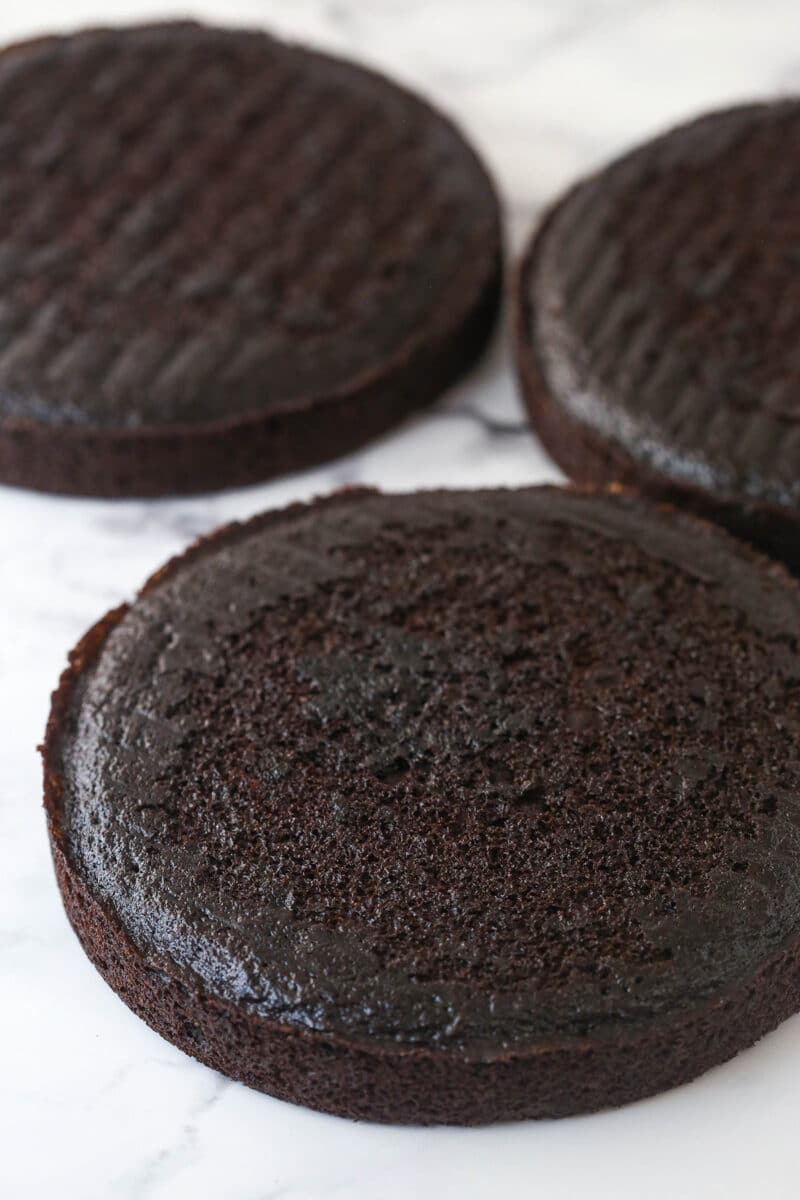 Three layers of chocolate cake arranged side by side.